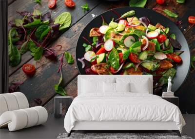 Traditional fattoush salad on a plate with pita croutons, cucumber, tomato, red onion, vegetables mix and herbs Wall mural