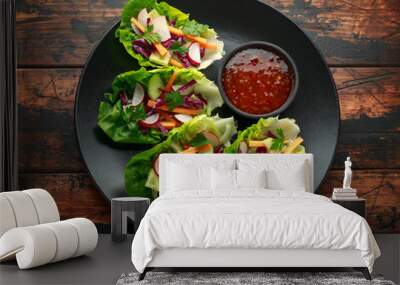 Vegetable lettuce wraps with carrot, onion, radish, red cabbage, cucumber and sweet chilli sauce Wall mural