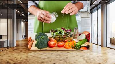 Chef man cooking in the kitchen. Wall mural