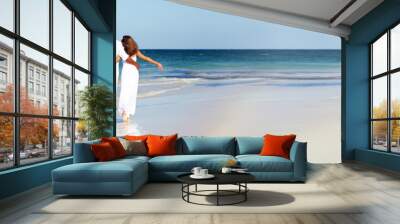 Couple walking on the beach Wall mural