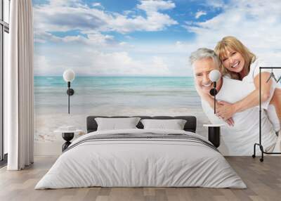 happy senior couple on the beach. Wall mural