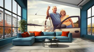 Two elderly people nesr car with keys Wall mural