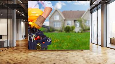 worker with a tool belt. Wall mural