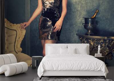 sexy brunette woman in a golden sequined dress Wall mural