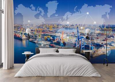 Large cargo port. Sea cargo port from bird's eye view. Maritime logistics concept. Process of loading containers onto transport vessel. Empty ferries near coast. International logistics Wall mural