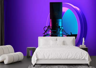 Mike for podcasts. Professional radio host microphone on purple background. Mike for recording internet podcasts. Concept of voice broadcasting. Round window with condenser Mike. Recording equipment Wall mural