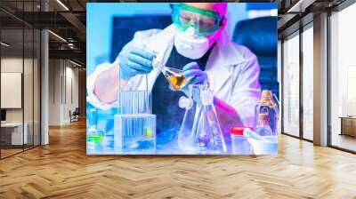 Smoke in the chemical laboratory. The man is tense. Chemical experiments. Biological laboratory. Lab technician is worried. Synthesis. Reagents emit smoke. Work with hazardous substances. Wall mural