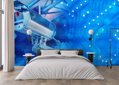 Surveillance camera. CCTV equipment in anti-vandal housing. Surveillance camera on blue. CCTV technologies for security. Surveillance camera for public places. CCTV with face recognition function Wall mural