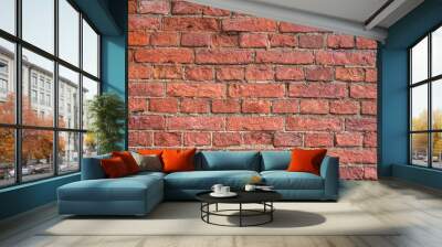 The brick wall is a warm shade. The pattern of the old bricks. Red-brown construction hair dryer. Old brick walls close-up. Wall mural