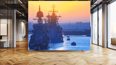 Warships. Rocket cruiser. Warships in the sun. Military cruisers against the background of the city. Wall mural