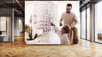 Family in optics store Wall mural