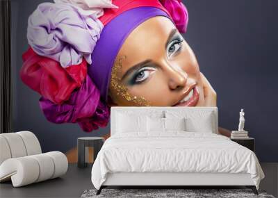 beautiful fashion model - colorful headwear smiling, gold makeup Wall mural