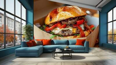 Fast food industry. Junk food. A fat burger with double beef patty, tomatoes, onion and cheese put in a greasy cardboard box Wall mural