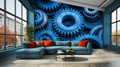 Close-up of blue metal gears interlocking, embodying teamwork and machinery, intricate engineering with a cool metallic tone. Wall mural