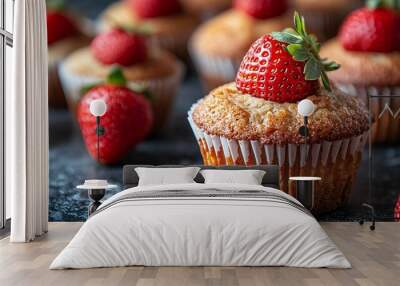 Close-up of vegan double strawberry muffins, showcasing their fluffy texture and vibrant red strawberries, with a focus on their delicious, fresh appearance. Wall mural