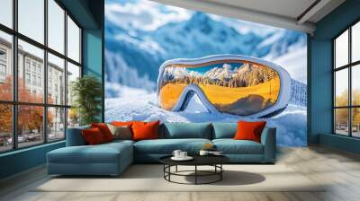 Ski goggles reflecting a snow-covered mountain landscape, capturing the essence of winter sports and outdoor adventure. Wall mural