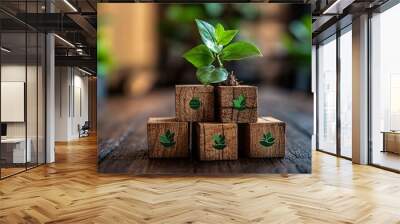 Wooden cubes with ESG icons and a green plant, representing sustainable investment and organizational growth in environmental and social governance. Wall mural