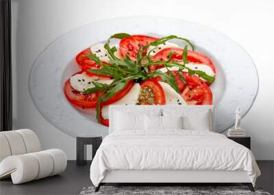 Caprese salad with mozzarella, tomatoes and pesto sauce. A traditional Italian dish. Isolated on a white background. Wall mural