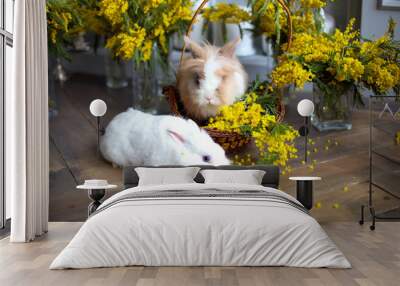 A pair of small rabbits on a background of flowers in the Valentine's theme Wall mural