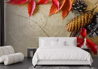 Autumn leaves on wooden table Wall mural