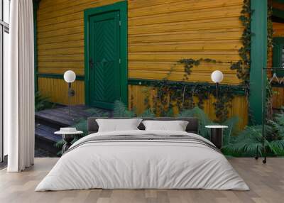 Atmospheric entrance to a wooden cottage with ferns Wall mural