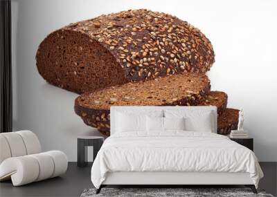 Freshly baked rye bread with slices, close-up, isolated on white background Wall mural