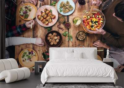 enjoying dinner together. Wall mural