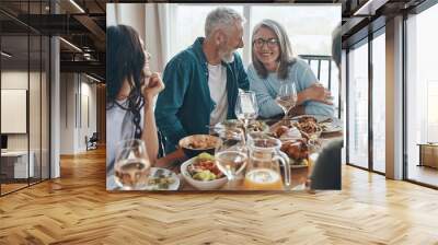 Happy multi-generation family communicating and smiling while having dinner together Wall mural