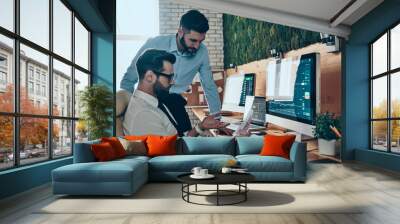 Two good looking young modern men in formalwear working using co Wall mural