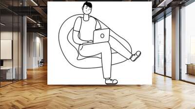 young man seated in sofa using laptop technology line style Wall mural