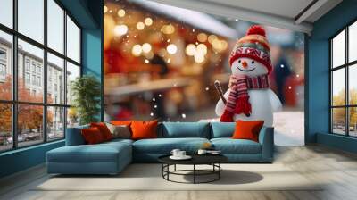 Charming cute cheery snowman wearing a festive red hat and scarf enjoying the snowy Christmas market in the Holiday. Banner with copy space Wall mural