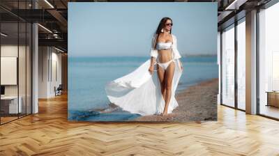 Close-up sensual sexy brunette tanned woman wear bikini rest sandy beach after taking swim warm beautiful ocean during summer vacation, hair wet look camera relaxed, sassy, perfect holiday resort.Life Wall mural