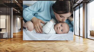 happy mother with little cute newborn at home Wall mural