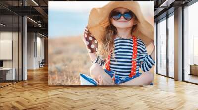 The happy little girl in a big hat Wall mural