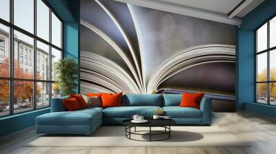 A close-up of open book pages with abstract background Wall mural