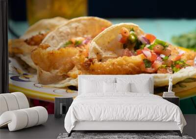 Mexican breaded fish tacos also called ensenada on turquoise background Wall mural