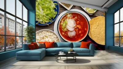 Mexican food. Red pozole with chicken on wooden background Wall mural