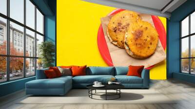 Mexican fried gorditas on yellow background Wall mural