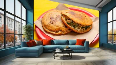 Mexican fried gorditas on yellow background Wall mural