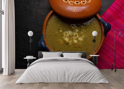 Mexican green pozole in cazuela on dark background Wall mural