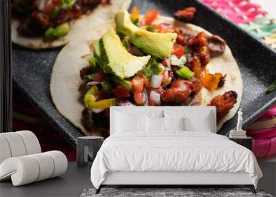 Mexican pork chorizo tacos with avocado and beans on white background Wall mural