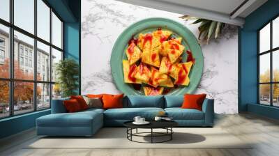 Pineapple with chili powder and chamoy. Mexican food Wall mural