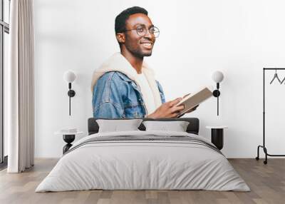 Portrait of smiling young african man student with book looking away wearing eyeglasses isolated on white background Wall mural