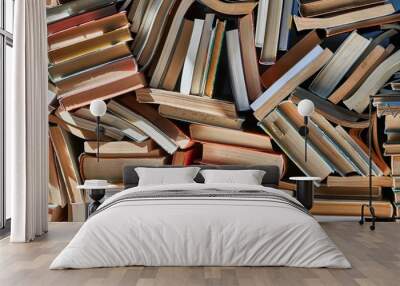 Pile of old books in dramatic dim light Wall mural