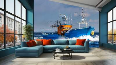 Fishing boat returns after fishing to its port. Japan. The water area of Hokkaido. Kunashir Strait. Sea of Okhotsk. Wall mural