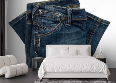 Folded dark blue jeans on a white background. Cloth. Jeans isolate Wall mural