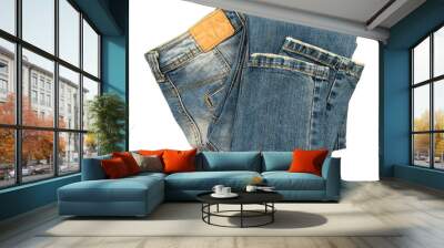 Folded dark blue jeans on a white background. Cloth. Jeans isolate Wall mural