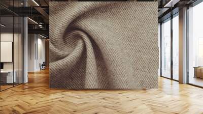 Texture of twisted dense material of brown color. Piece of fabric with waves for tailoring Wall mural