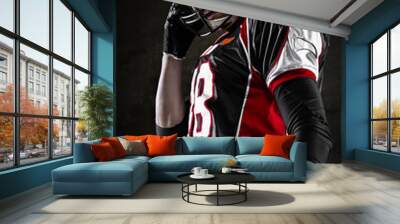 Portrait of american football player looking aside Wall mural