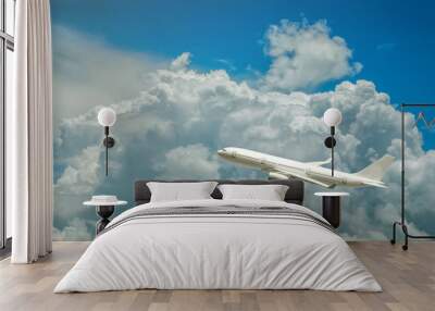 The white B-6120 Airbus airplane in the blue sky and white clouds in the light of afternoon.  Wall mural